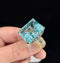 Large aquamarine platinum ring with bead-set diamonds and sculpted shoulders