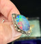 Rhoda Wager Australian opal doublet brooch featuring gold and silver leaf design, showcasing vibrant colours.