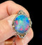 Signed Rhoda Wager opal doublet brooch framed in gold and silver, emphasising intricate detailing.