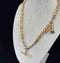 Victorian T-Bar chain with fancy star link pattern in yellow gold.