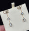 Elegant Edwardian earrings with aquamarine drops and pearl accents, crafted in gold.
