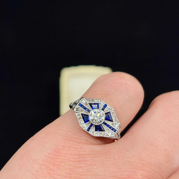 Front view of a 1930s art deco geometric sapphire and diamond ring in platinum