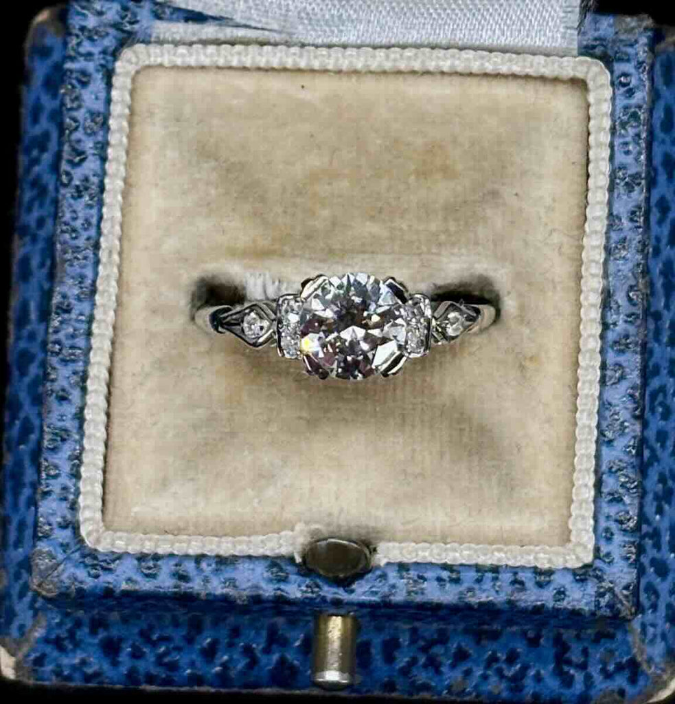 1.13ct brilliant cut diamond centre with 6 old cut diamonds on the shoulders.