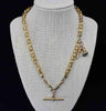 A Late Victorian antique 15ct yellow gold Albert chain featuring a T-Bar and fancy link star set design.