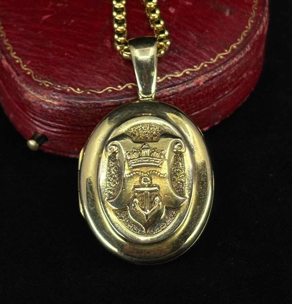 15ct gold Victorian locket titled "Triumph & Hope" with textured background and detailed heraldic relief — antique locket