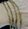 Close-up of the antique Edwardian 9ct gold guard chain showing elongated fancy links alternating with small round links