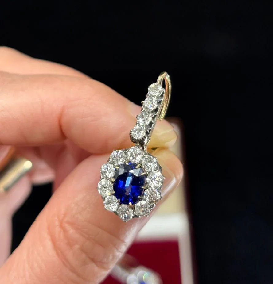 Vintage 1885 earrings by Erik Kollin featuring deep blue Ceylon sapphires set in silver and 14ct yellow gold with old cut diamonds.