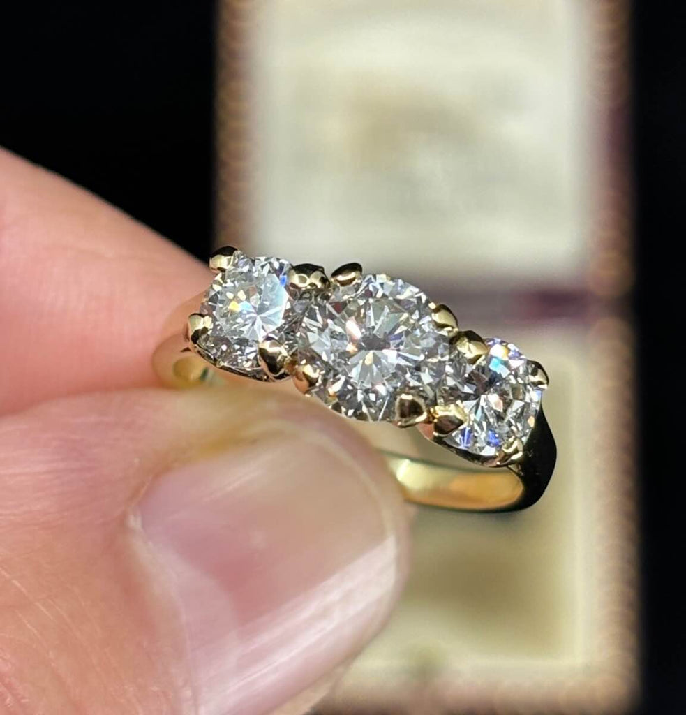 18ct yellow gold trilogy with 1.09ct centre diamond.