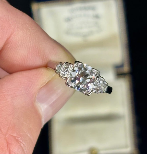 Stunning 1920s antique diamond engagement ring with a square-cut diamond and platinum band, reflecting classic Art Deco style.