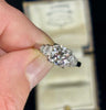 Stunning 1920s antique diamond engagement ring with a square-cut diamond and platinum band, reflecting classic Art Deco style.