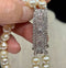 1920s Art Deco Akoya pearl necklace with intricate diamond clasp.