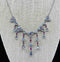 1920s moonstone and ruby fringe necklace in sterling silver, exemplifying vintage Art Deco style.