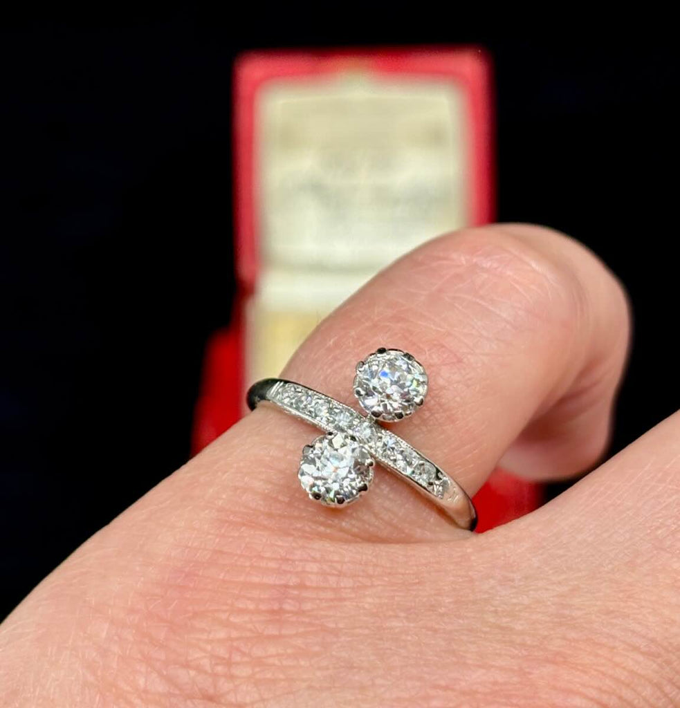 1920s Old European cut diamond ring in platinum top with nine early single cut diamonds and half 18ct white gold lower band.