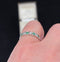 Vintage 1930s emerald and diamond eternity ring set in platinum.