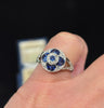 1930s art deco Ceylon sapphire and diamond ring sitting flush on the finger.