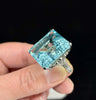 Large aquamarine platinum ring with bead-set diamonds and sculpted shoulders