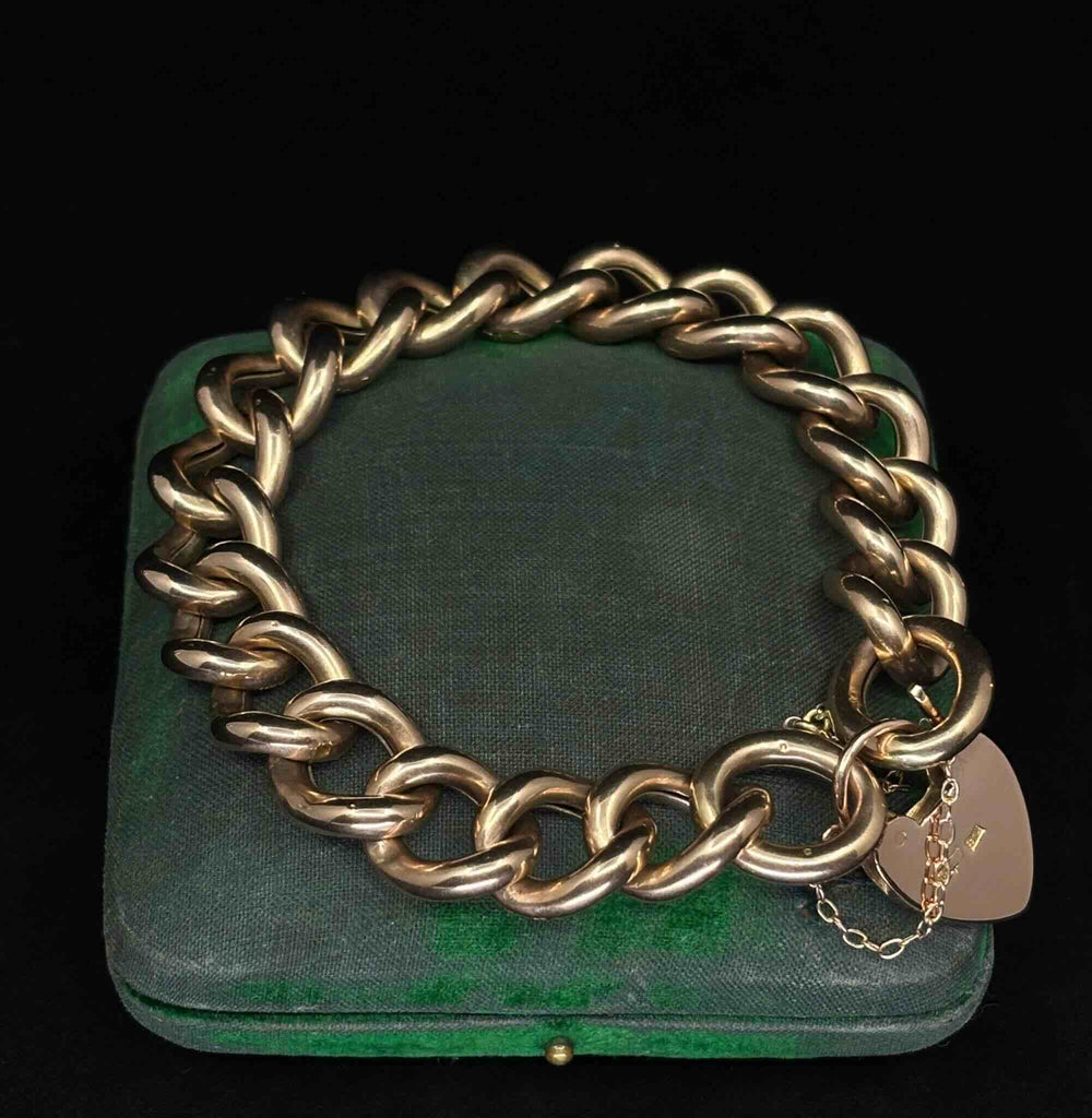Reverse view of the antique Victorian rose gold bracelet showing polished curb links and heart padlock clasp