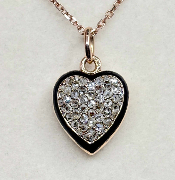Front view of an antique Victorian diamond heart locket in 15ct rose gold with rose-cut diamonds and black enamel