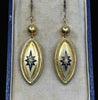 Pair of Victorian 15ct yellow gold navette drop earrings with blue enamel starbursts and natural seed pearl centres