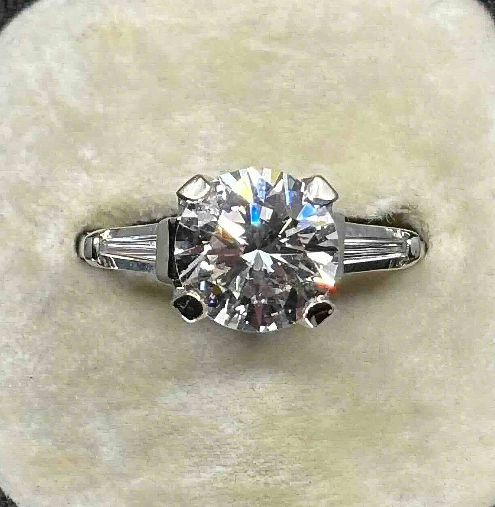 Angled view of the vintage 2.43ct diamond engagement ring showing its brilliant cut centre and 18ct white gold setting