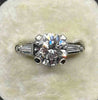 Angled view of the vintage 2.43ct diamond engagement ring showing its brilliant cut centre and 18ct white gold setting