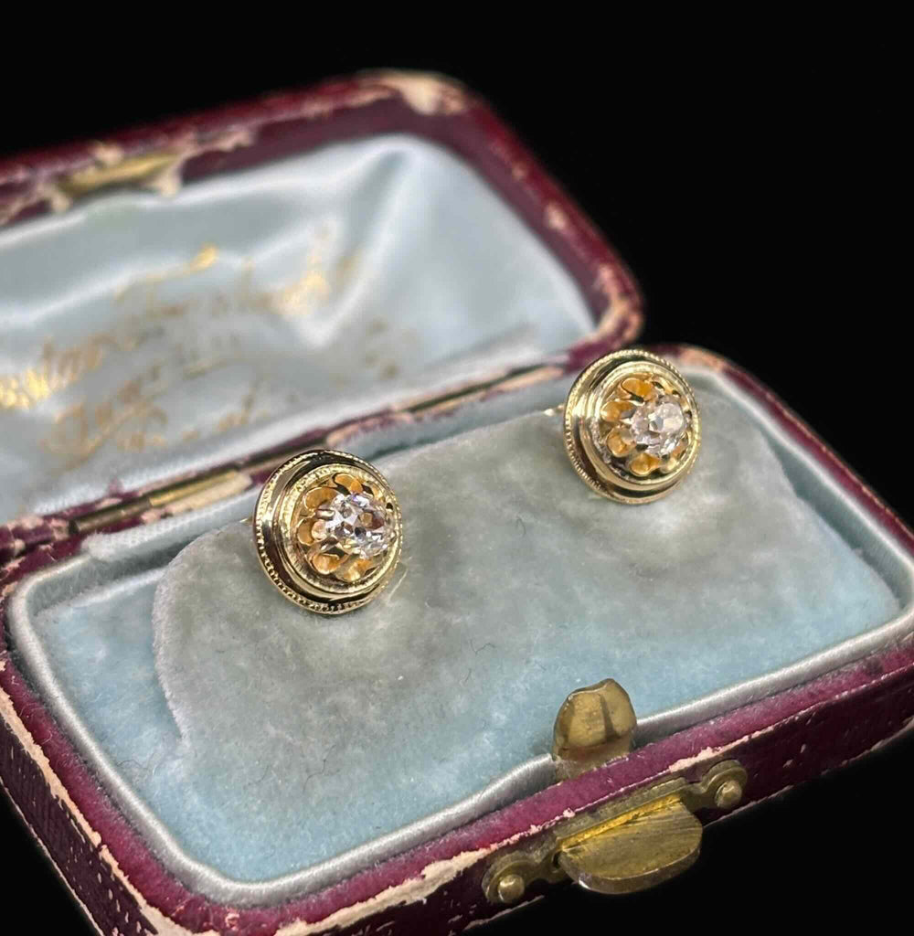 Close-up detail of old mine cut diamonds in 18ct gold earrings