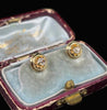 Close-up detail of old mine cut diamonds in 18ct gold earrings