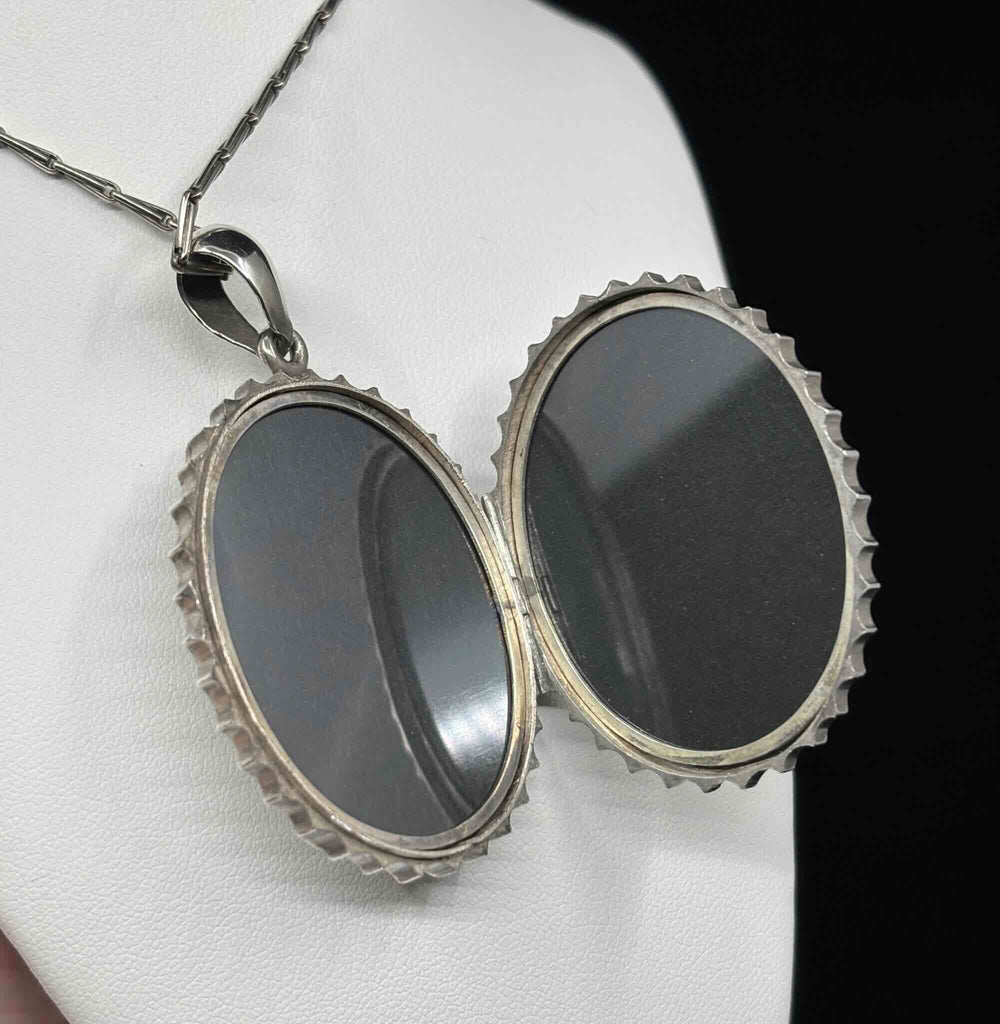 Open antique Victorian silver buckle locket showing rare original glass on both sides and its hinged interior