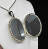 Open antique Victorian silver buckle locket showing rare original glass on both sides and its hinged interior