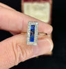 Detailed image of a 1930s sapphire and diamond ring, highlighting the rectangular cluster and two-tone metal.