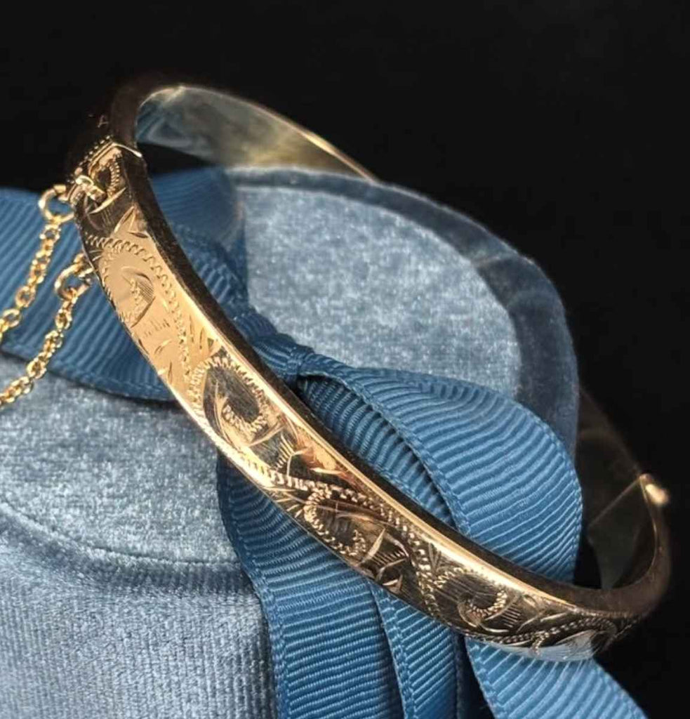 Interior view of contemporary 9ct yellow gold hinged bangle construction.