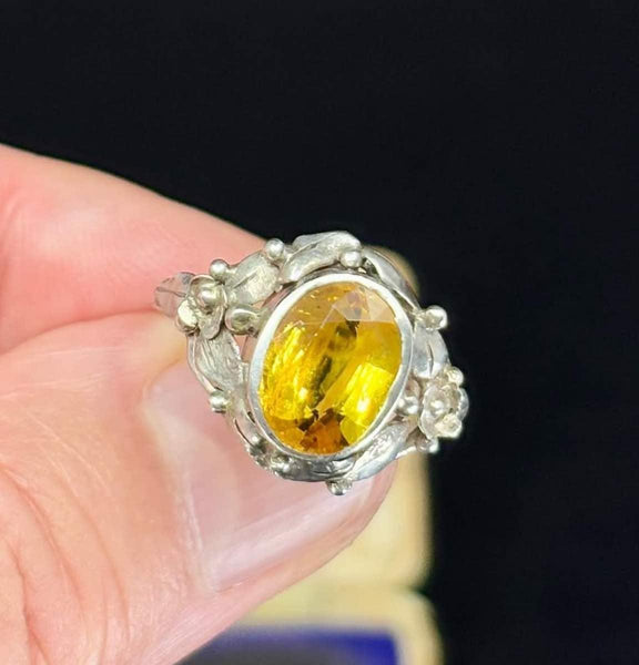 Antique Rhoda Wager silver ring from the 1930s, featuring a beautiful citrine stone and floral embellishments.