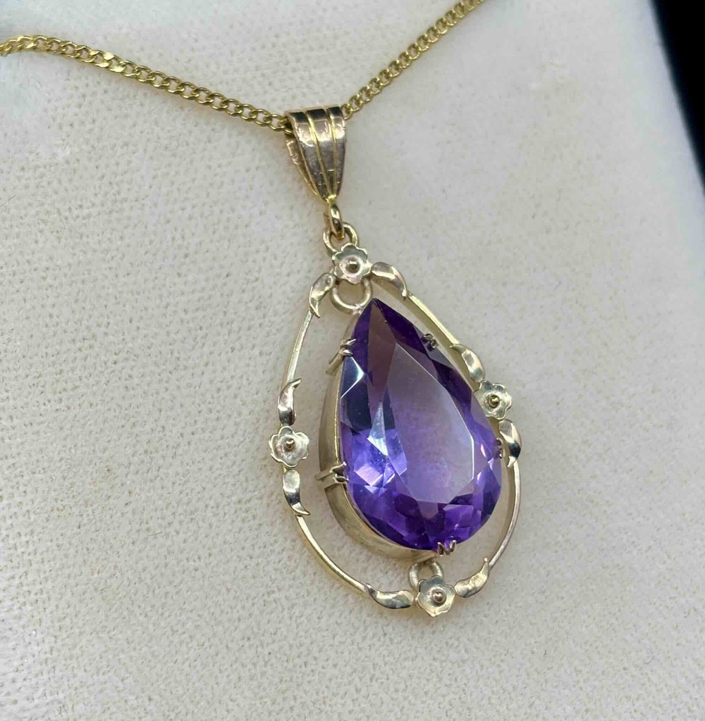 Side view of the antique australian pendant highlighting the vivid purple hue of the amethyst stone
