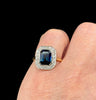 Antique cluster ring from the 1930s featuring a stunning sapphire surrounded by a halo of diamonds.