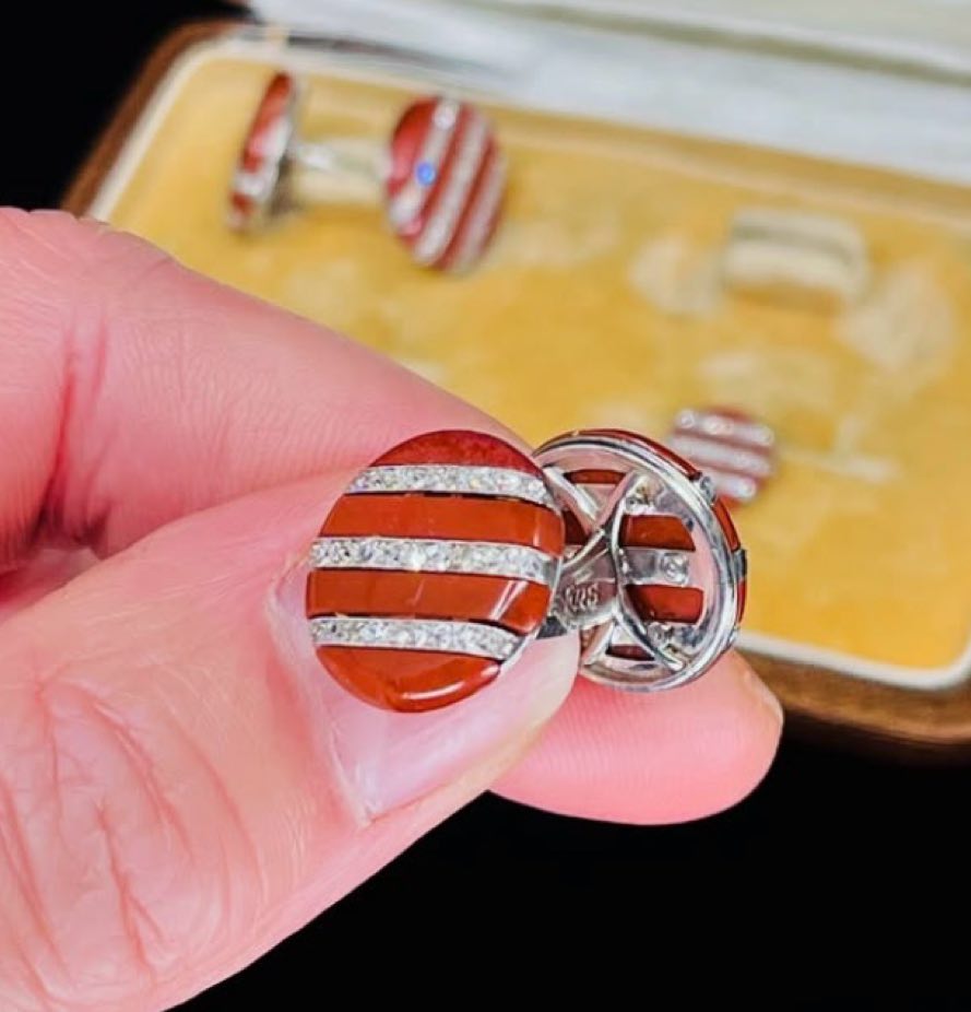 Antique Lacloche Frères cufflinks and collar pins set with a unique design of alternating jasper and diamond stripes, reflecting 1920s elegance.