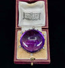 Antique Russian amethyst and diamond brooch from 1890 with intricate gold setting.