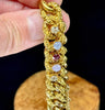 Antique Victorian curb link bracelet made of 15ct gold featuring ruby, diamond, and star sapphire gemstones.