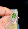 A captivating Victorian ring featuring a central peridot and diamond cluster, reflecting the elegance and artistry of the 1880s.