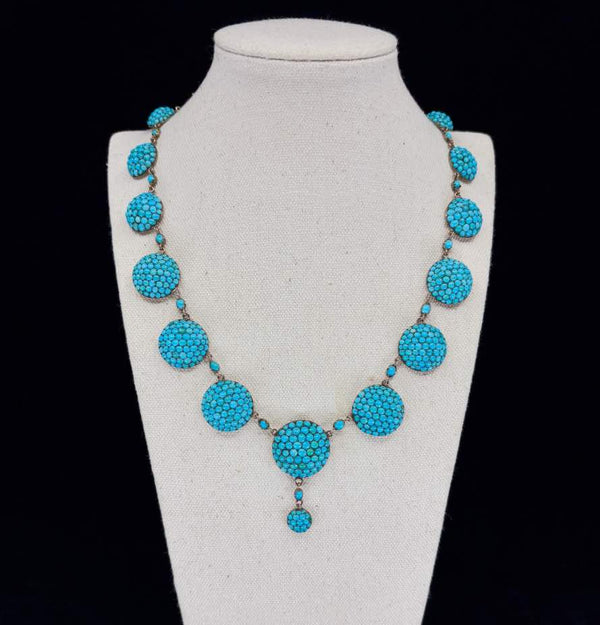 Front view of a rare antique Victorian turquoise necklace, circa 1880, with pavé set turquoise stones and yellow gold links.