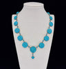 Front view of a rare antique Victorian turquoise necklace, circa 1880, with pavé set turquoise stones and yellow gold links.