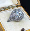 Side oblique view of the Art Deco Platinum 3.59ct Diamond Cluster Ring in a cream antique ring box