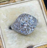 Side view of the Art Deco Platinum 3.59ct Diamond Cluster Ring in a cream antique ring box