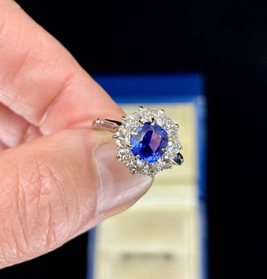 Art Deco engagement ring featuring a Ceylon color change sapphire and diamond cluster.
