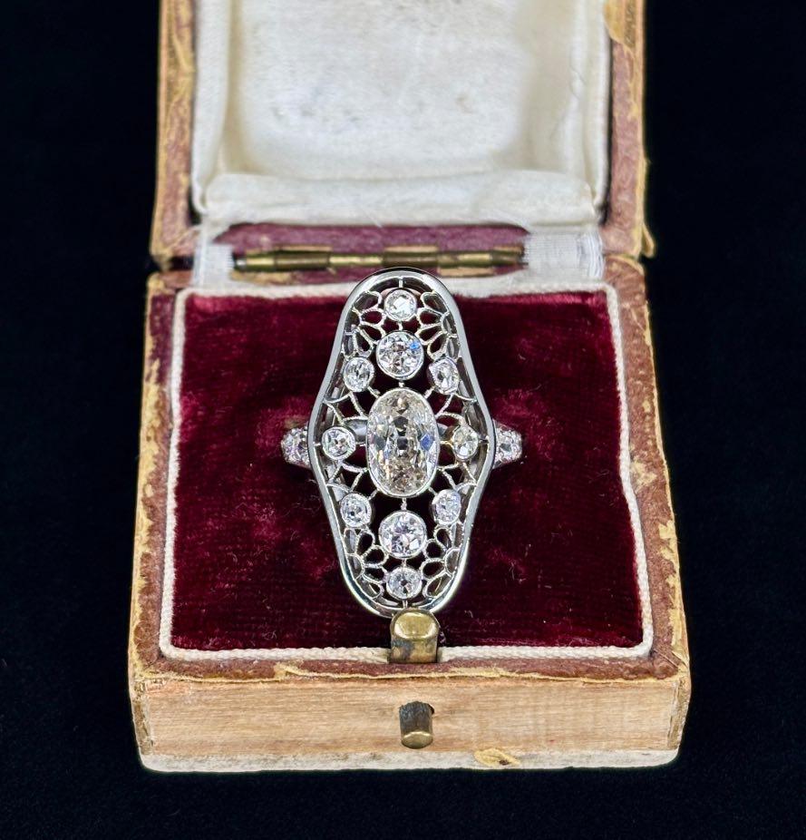 Vintage Art Deco diamond ring with openwork plaque style, showcasing exquisite craftsmanship.