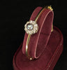 Elegant Art Nouveau-style bangle with a central black pearl and diamond cluster, showcasing exquisite craftsmanship.