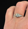 Australian 1940s diamond engagement ring photographed on the ring finger emphasising its soft, feminine design.