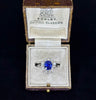 Elegant diamond halo ring with a color change Ceylon sapphire center piece.