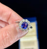 Close-up of a color change Ceylon sapphire cluster ring set with diamonds.