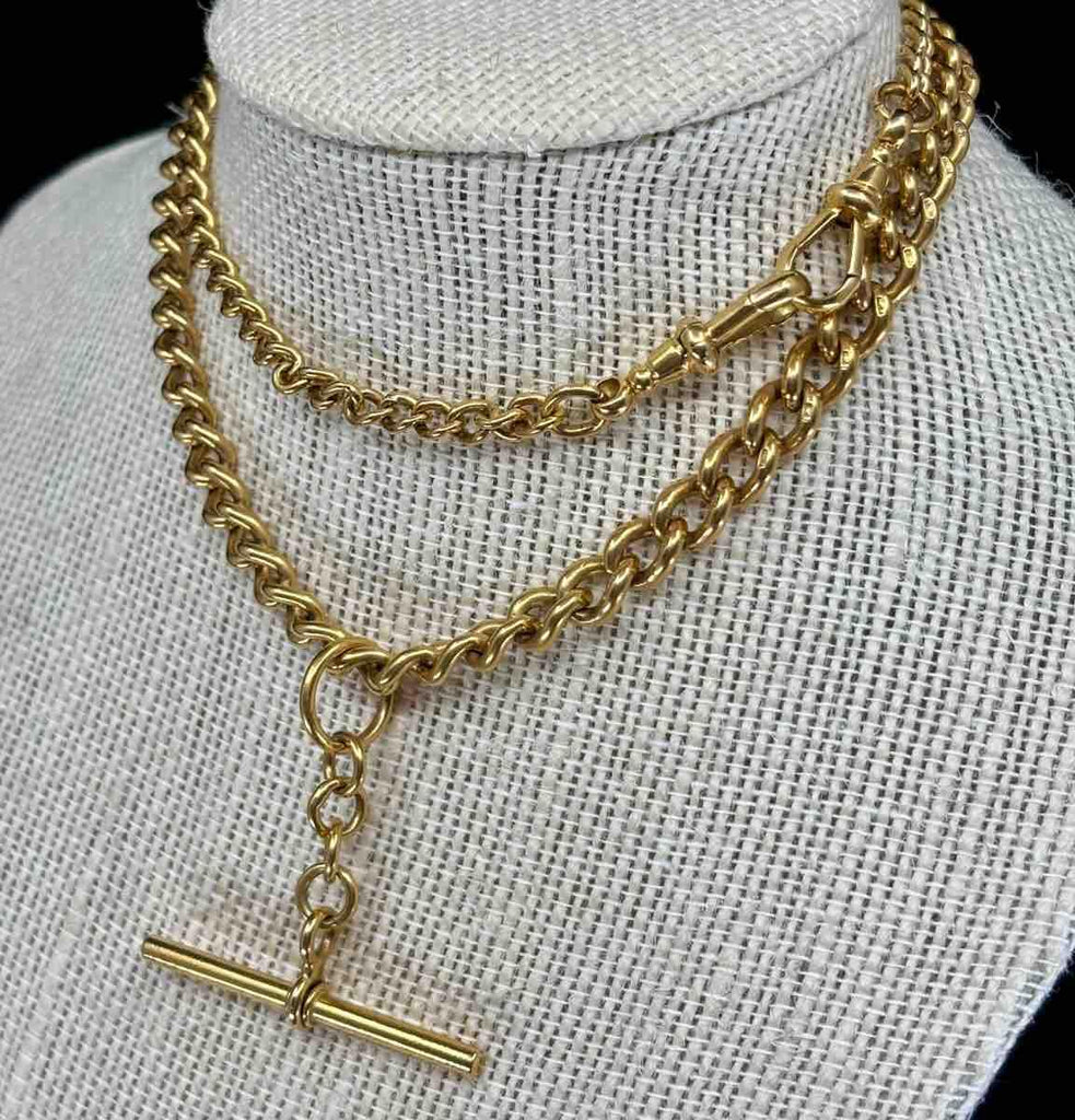 Edwardian gold Albert chain with a graduated curb link design, reflecting period artistry.