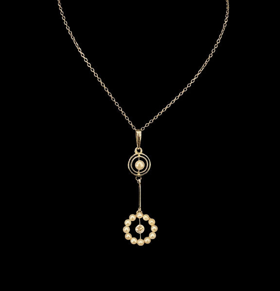 Edwardian natural pearl and diamond garland drop pendant on an integral fine platinum chain.